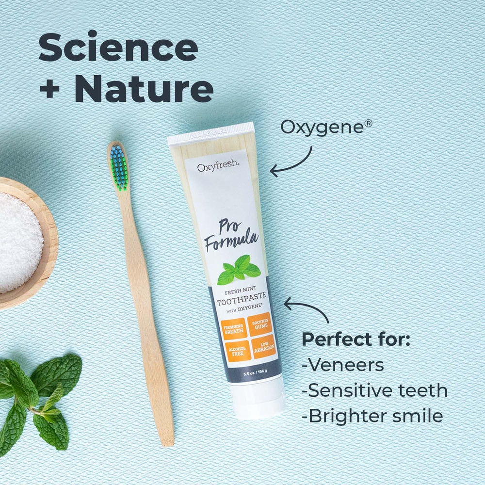 Toothpaste being squeezed onto a toothbrush for application