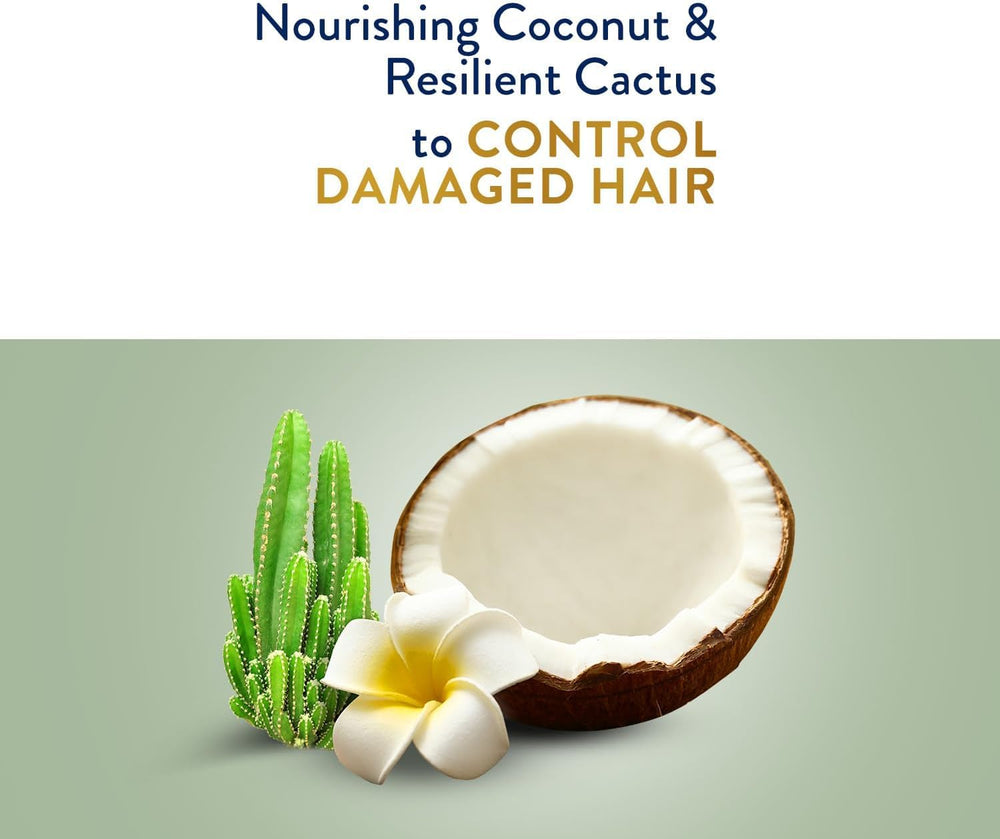 Applying Parachute Gold cream to damp hair for frizz control and softness
