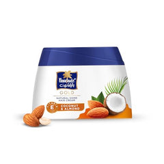Parachute Gold hair cream texture closeup reveals rich, creamy consistency.