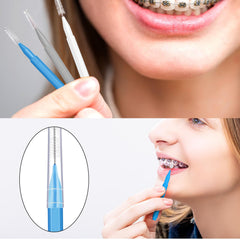 Brace brush being used to clean between teeth