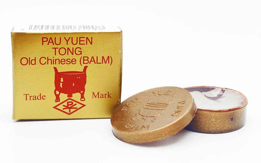 Pau Yuen Tong Old Chinese Balm ingredients close-up highlights aromatic oil, cloves, and ginseng.
