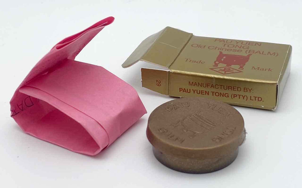 Pau Yuen Tong Old Chinese Balm jar foregrounds traditional balm texture for soothing routines.