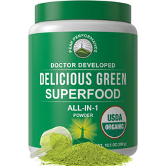 Peak Performance Organic Greens Powder jar with scoop on white background