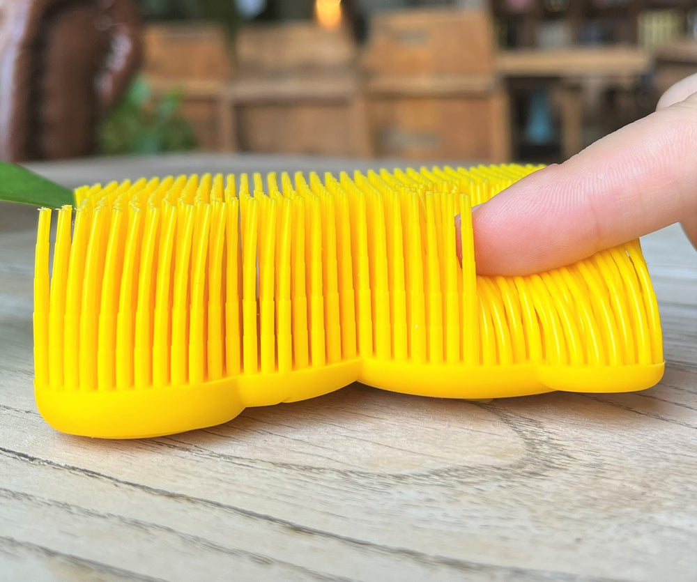 Penepico bear-yellow sensory brush back view highlighting compact ergonomics