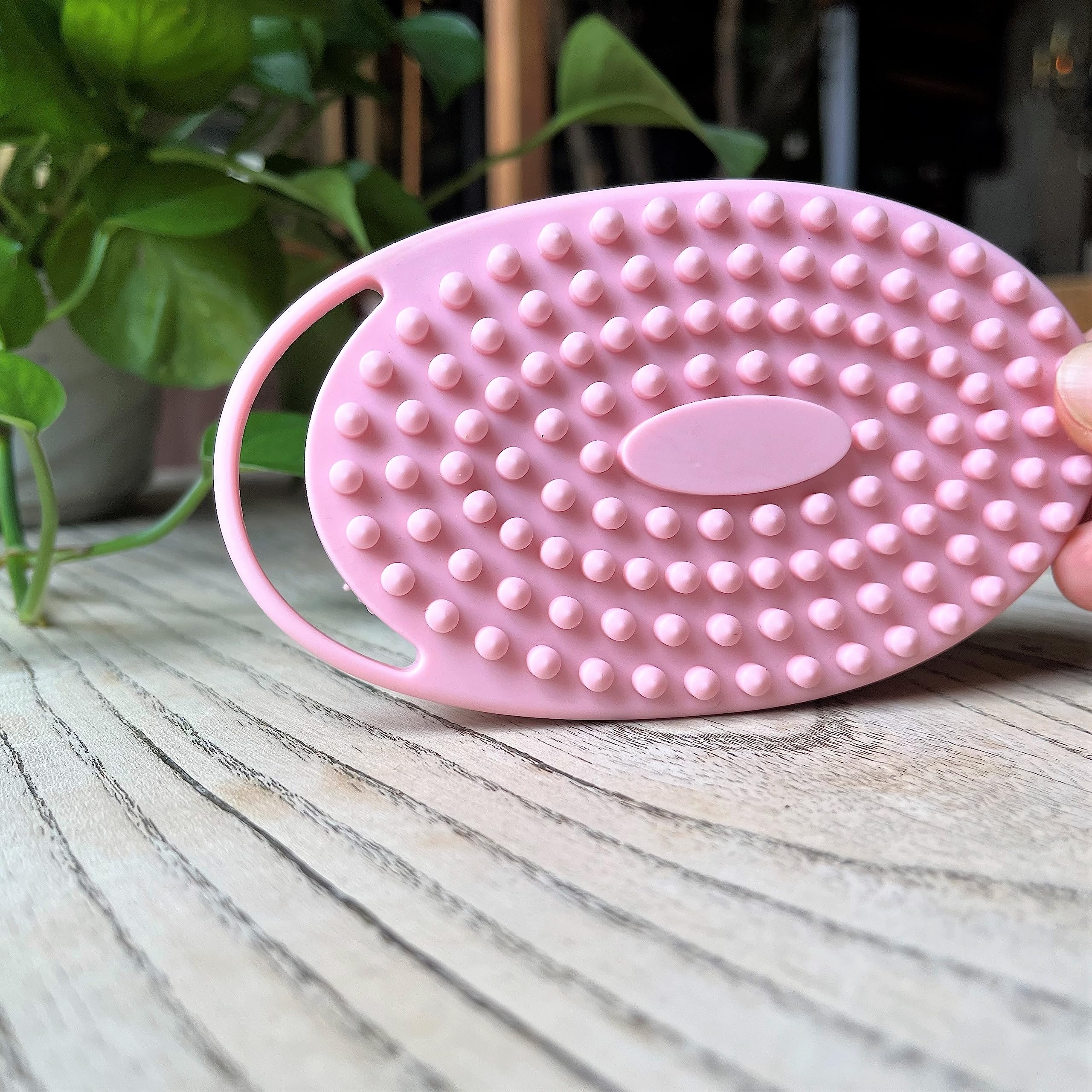 Penepico hanging pink sensory brush showcases convenient storage and quick access.