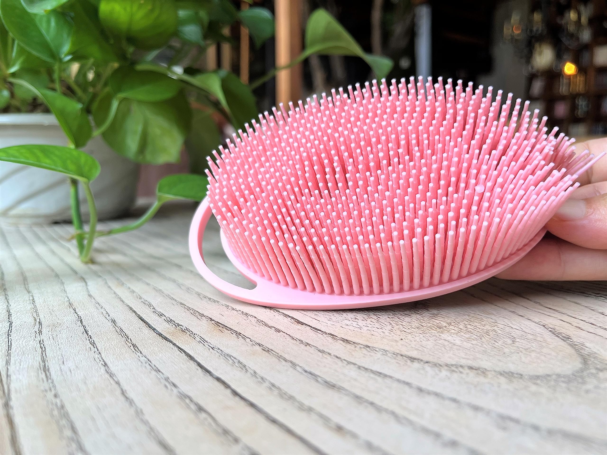 Penepico oval pink sensory brush with two sides for adjustable stimulation.