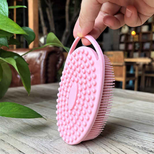 Penepico whale-shaped sensory brush in pink offers gentle tactile input during bath time.