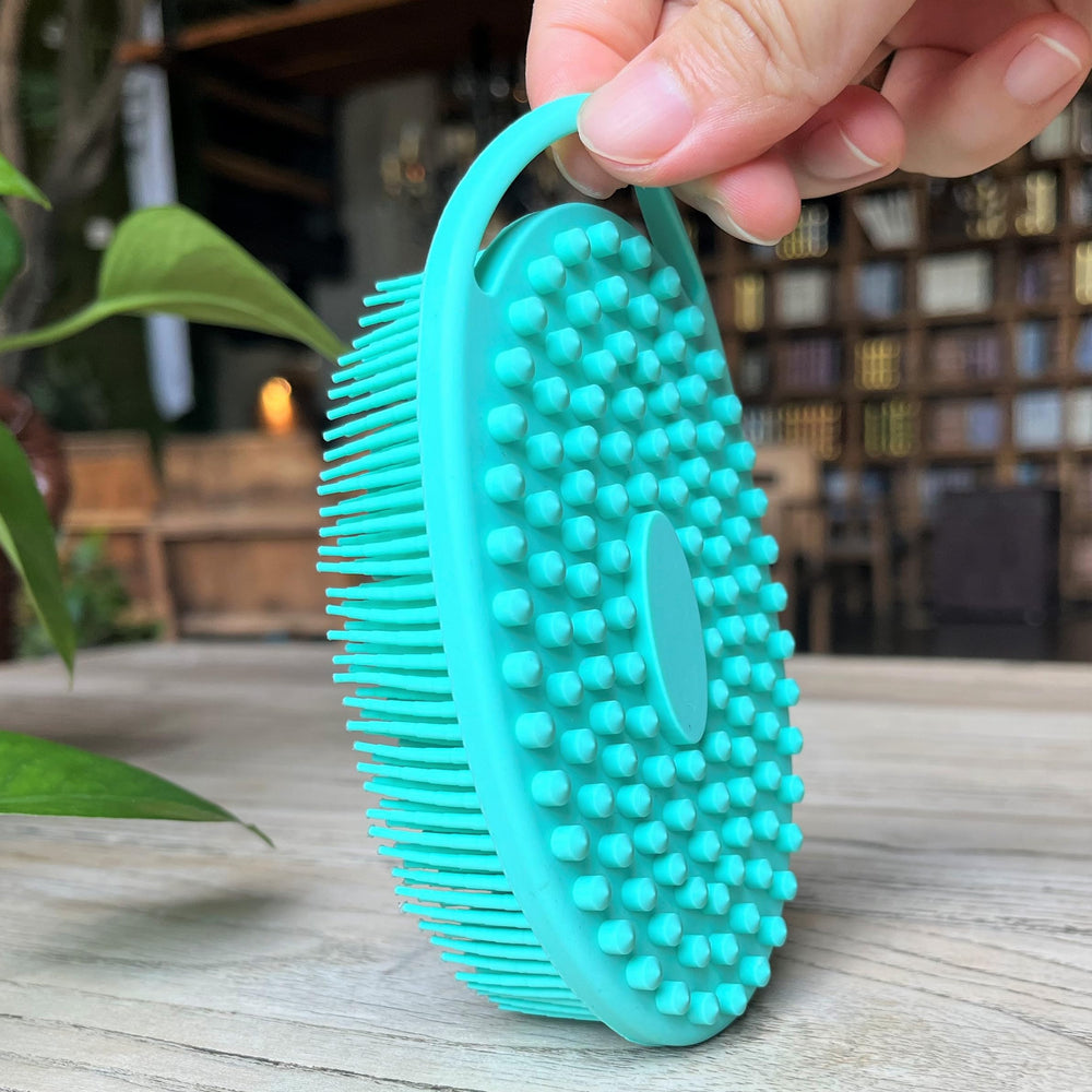 Penepico sensory brush teal oval hangable for soothing touch and easy storage.
