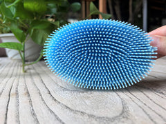 Penepico silicone loofah for shower with soft exfoliation.