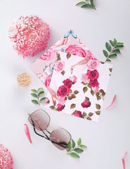 Six colorful square cleaning cloths with floral designs