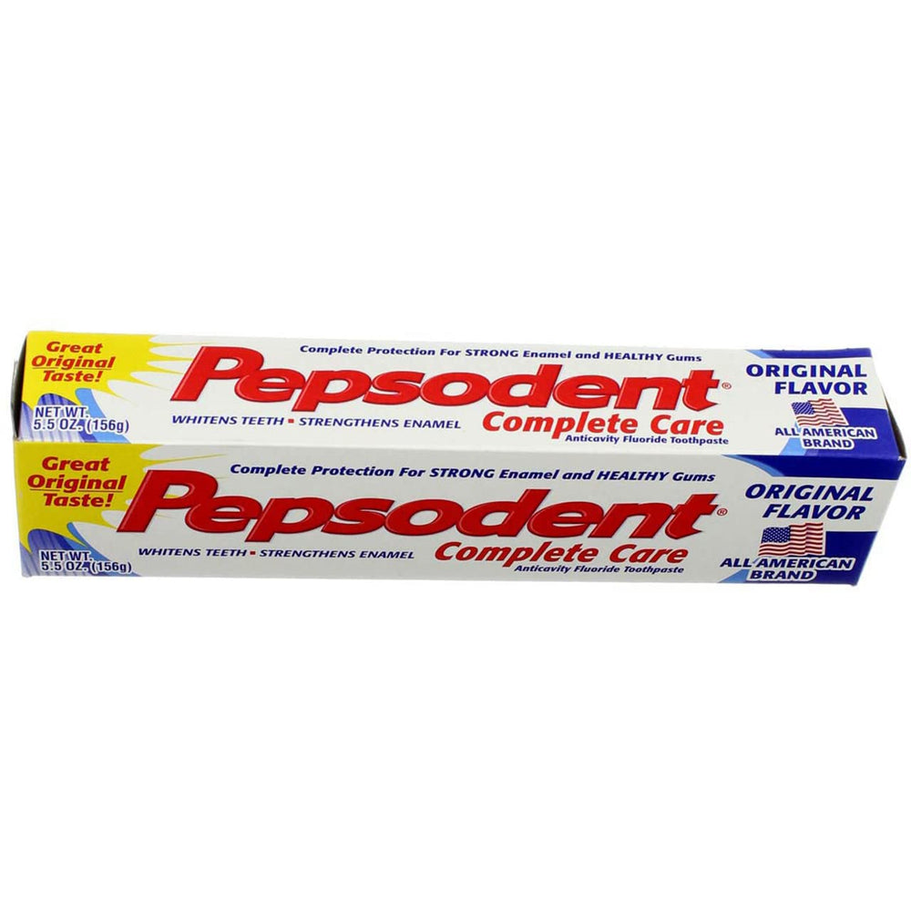 Toothbrush with Pepsodent toothpaste showing whitening effect