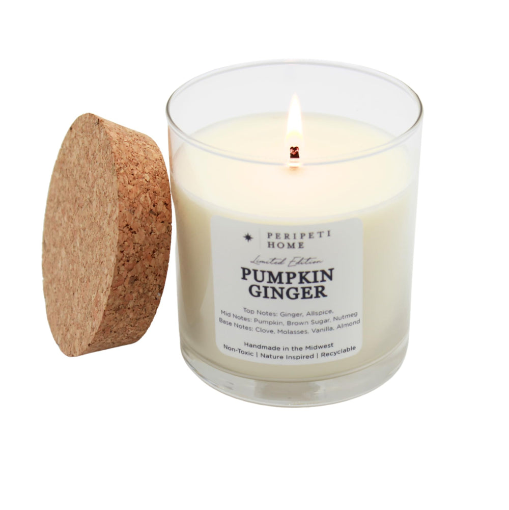 PeripetiHome pumpkin-ginger candle jar glowing to create warm fall ambience.