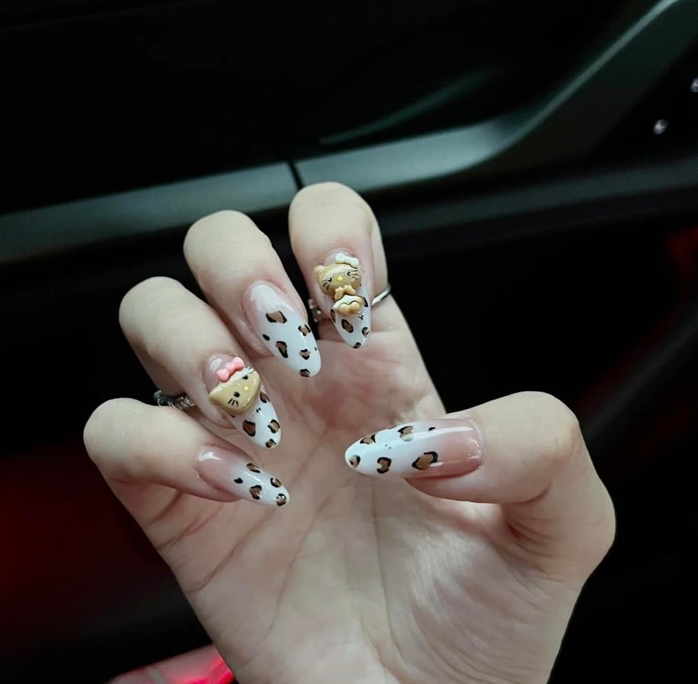 Close-up of Pethawata leopard nails, medium oval shape for easy fit