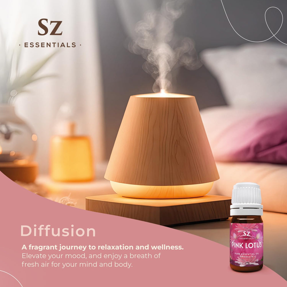 Vial of Pink Lotus essential oil on wooden surface