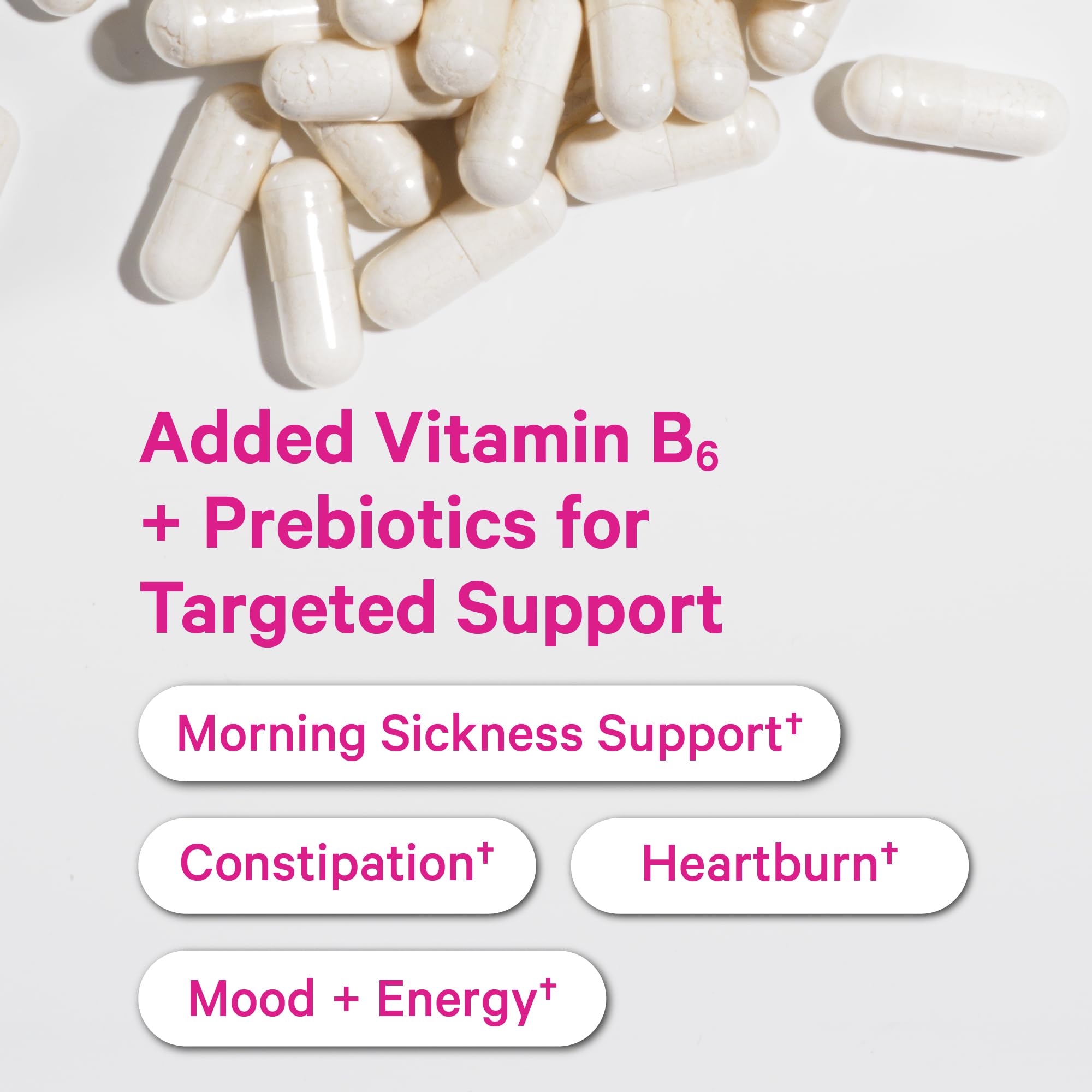Three capsules of Pink Stork Prenatal Probiotic on white background
