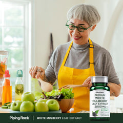 Piping Rock bottle beside mulberry leaves showing botanical source and freshness