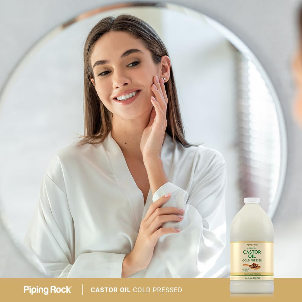 Piping Rock castor oil beside towels in bathroom illustrating daily use