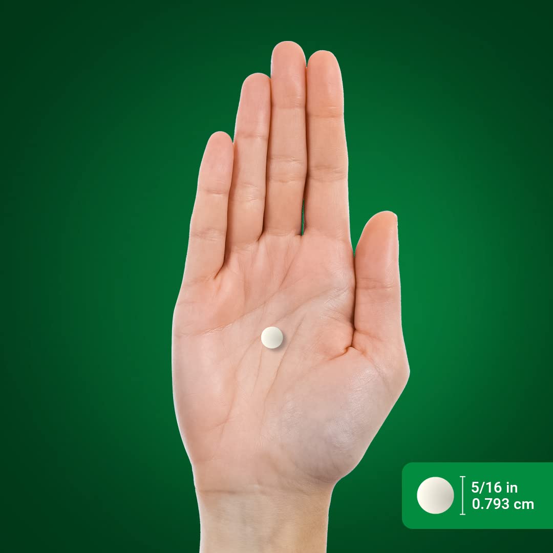 Piping Rock hand holding a tablet showing coated finish and ease of swallowing before use