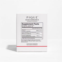 Single PIQUE liposomal Vitamin C + Elderberry packet on white background