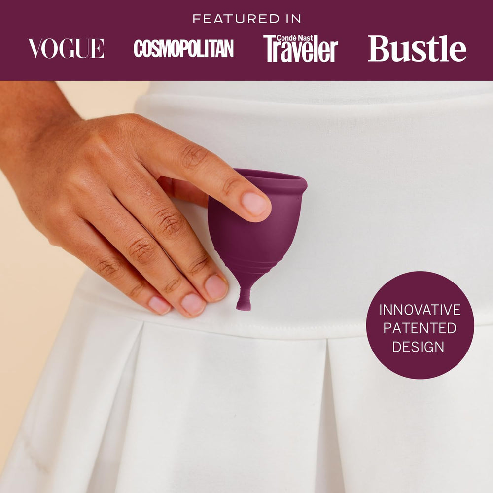 Pixie Cup Plum Large in-hand shows reusable silicone comfort and fit.