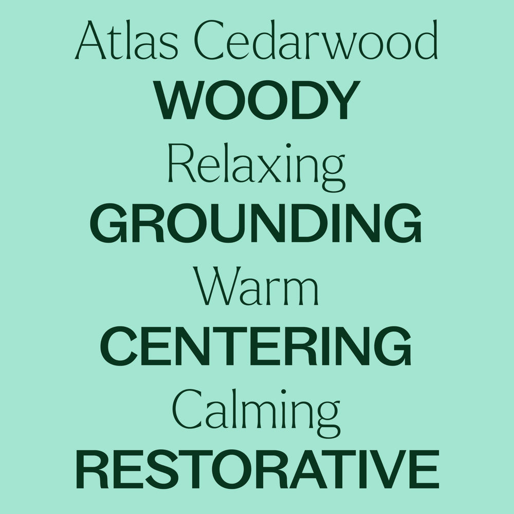 Cedarwood Atlas essential oil bottle on wooden surface