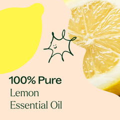 Close-up of clear lemon essential oil in glass bottle