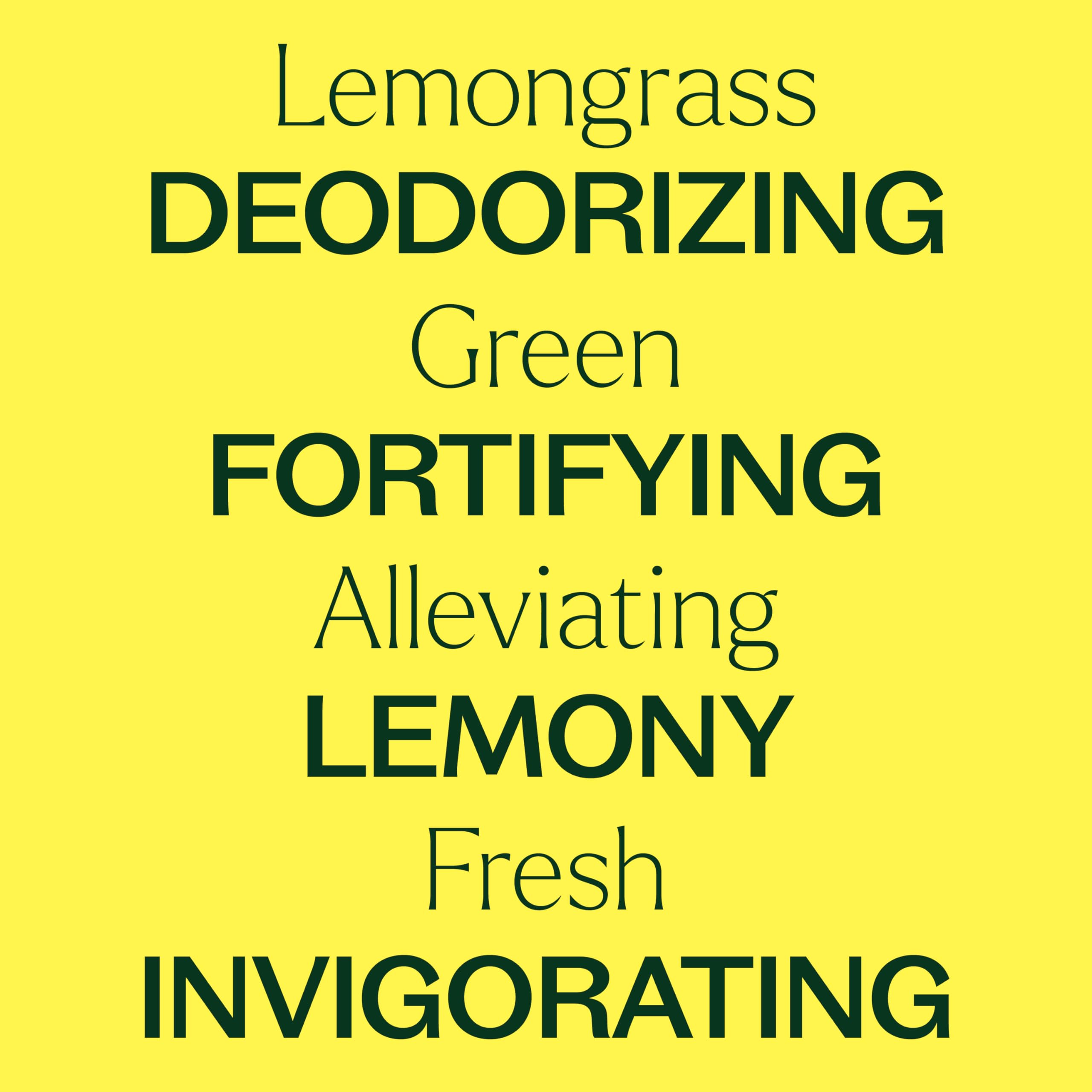 Set of essential oil bottles including Lemongrass on wooden surface