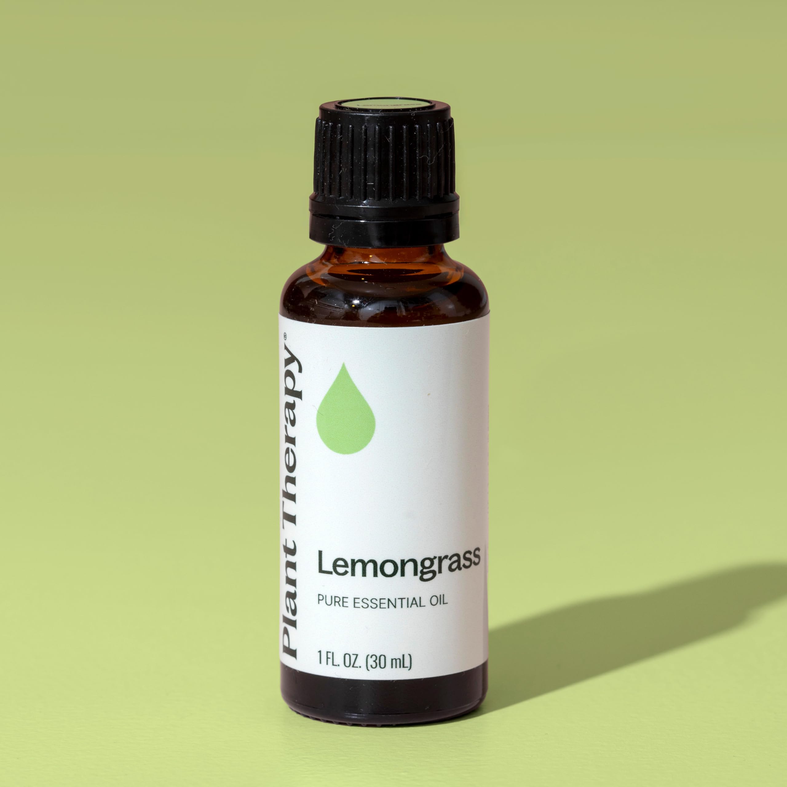Uncapped bottle of lemongrass essential oil with dropper