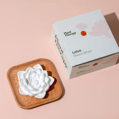 Lotus diffuser in a cozy bedroom setup