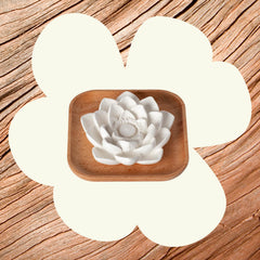 Close-up of the unglazed lotus flower on a natural wood base