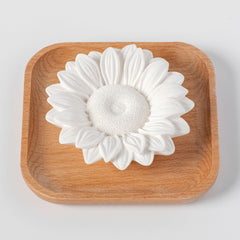 Close-up of wood base and ceramic plaster combination