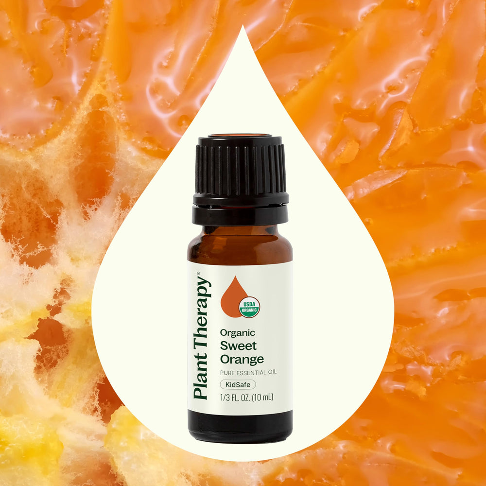 Orange essential oil bottle with dropper cap