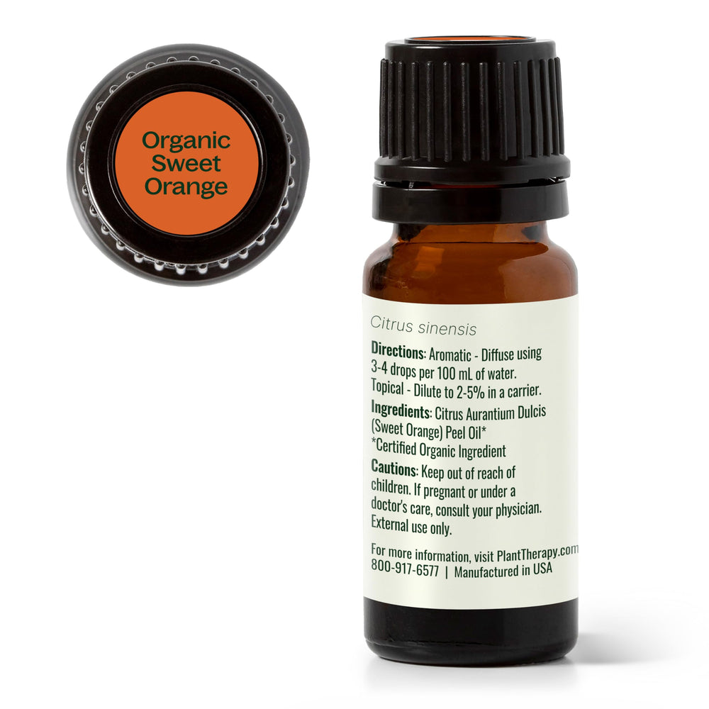 Aromatherapy setup with orange essential oil and diffuser