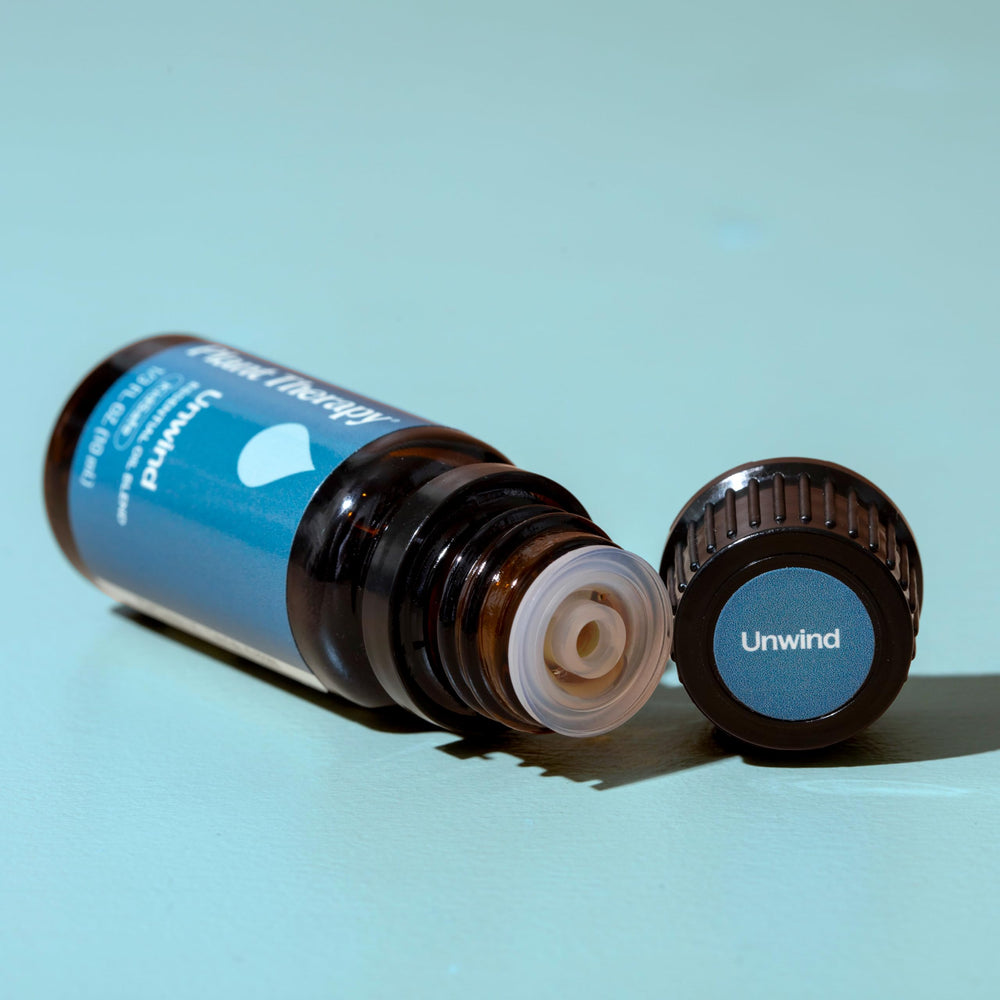 Unwind essential oil blended with a carrier oil for massage