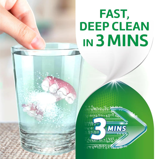 Effervescent tablet dissolving in denture cleaning cup