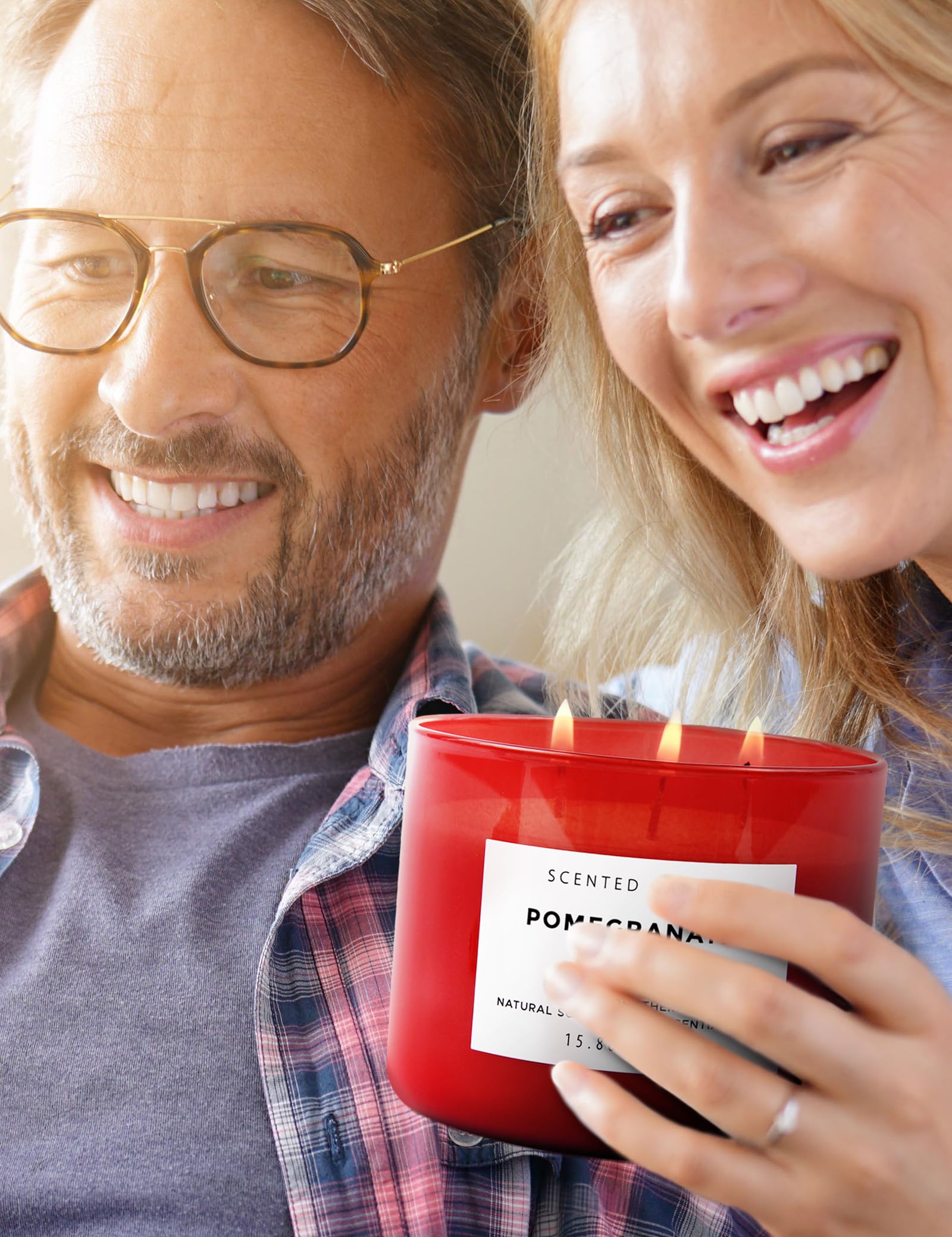 Side view of red glass jar with Pomegranate Noir Vanilla 3-Wick Candle