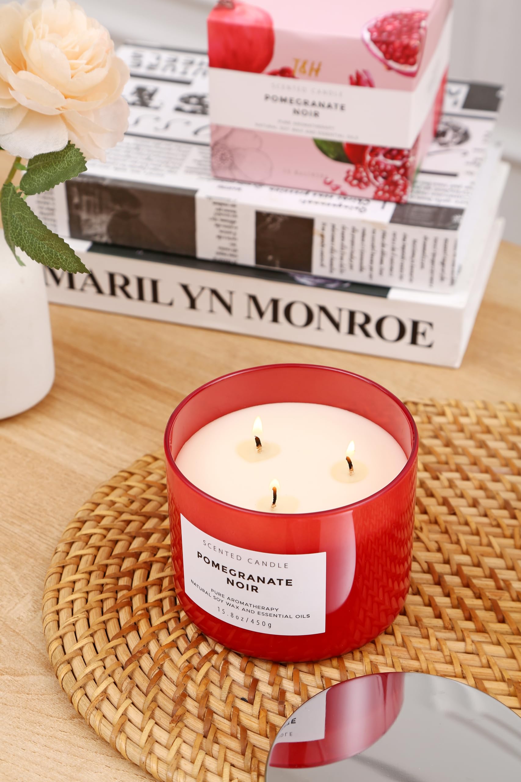 Ambient room scene featuring Pomegranate Noir Vanilla 3-Wick Candle