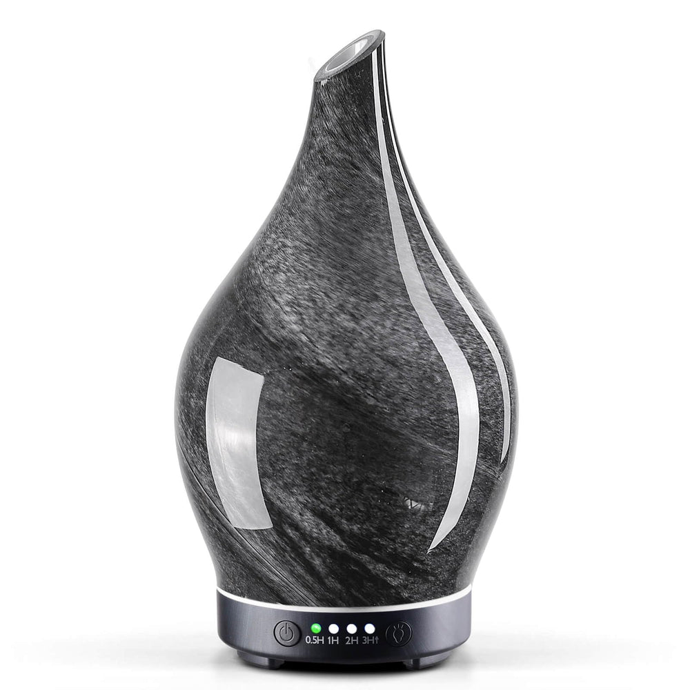 Porseme 150ml glass diffuser in Obsidian with star-shaped glass cover and wood grain base