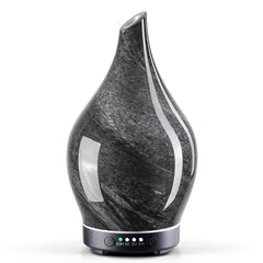 Porseme 150ml glass diffuser in Obsidian with star-shaped glass cover and wood grain base