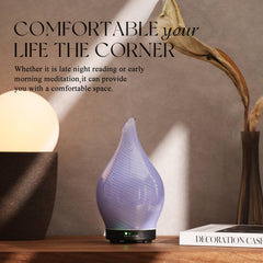 Porseme diffuser in a cozy bedroom/spa setting with purple glass