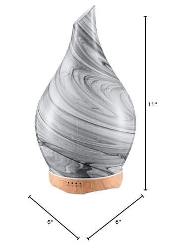 Close-up of hand-blown glass globe and wooden base diffuser