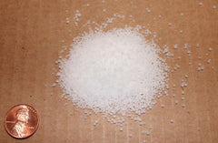 Close-up view of a resealable 5 lb bag of potassium chloride (KCl)