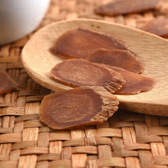 Ginseng slices soaking in a bottle for wine infusion