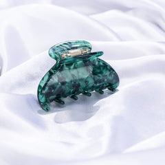 Prettyou France-designed barrette detail highlights handcrafted Italian material and shine.