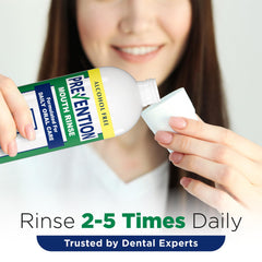 Mouthwash being poured into a cup for daily rinse
