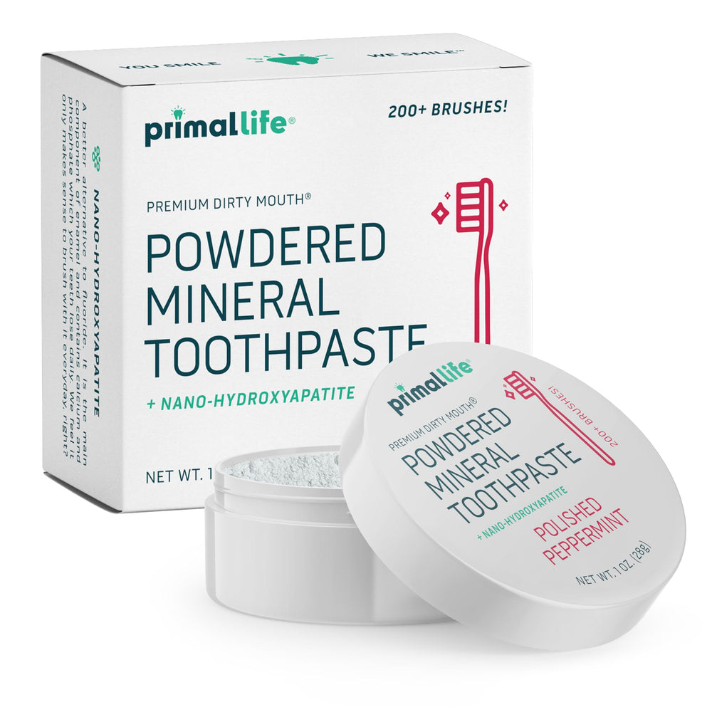 Front view of Primal Life Organics Dirty Mouth Toothpowder tin with label