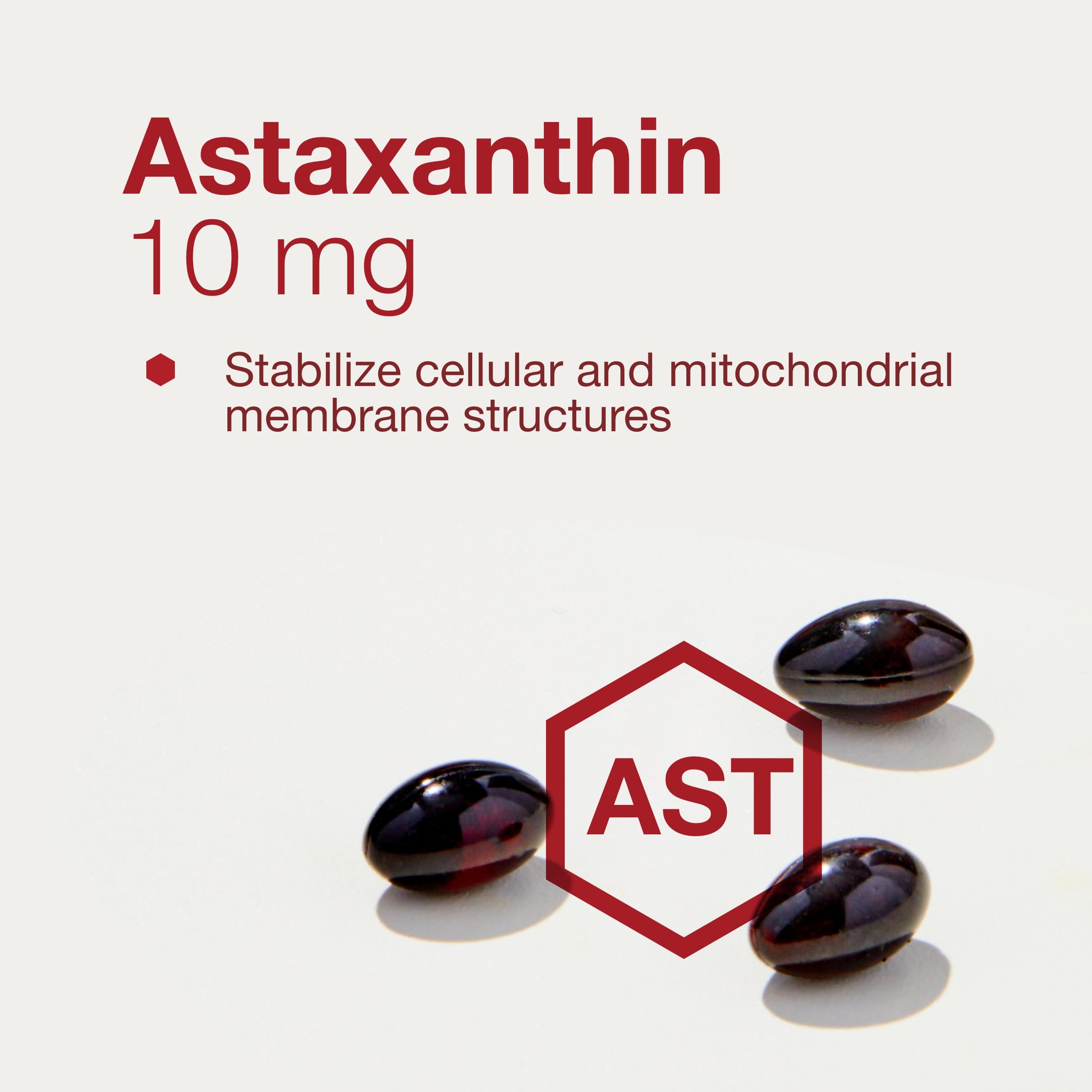 Bottled astaxanthin softgels on white background
