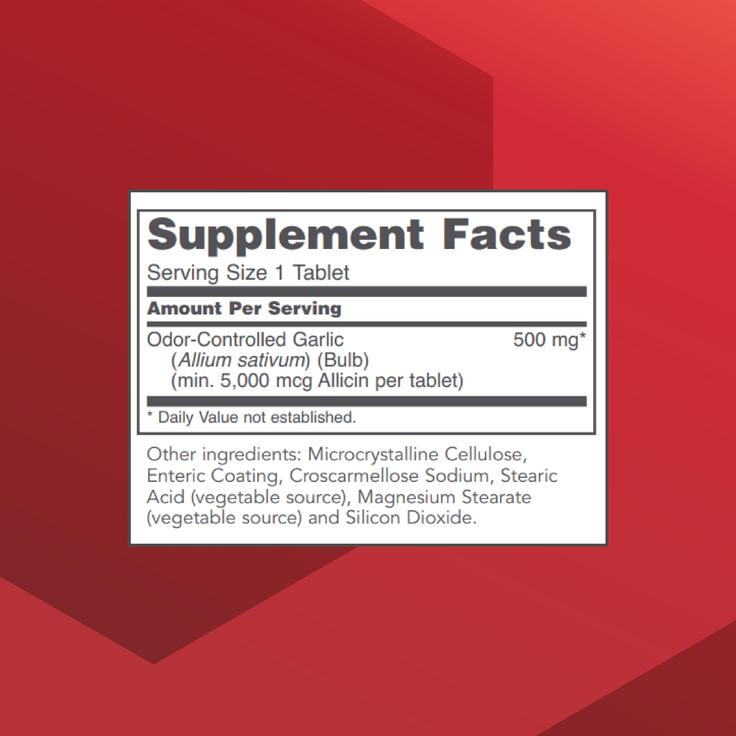 Close-up of enteric-coated garlic tablets labeled 5,000 mcg allicin