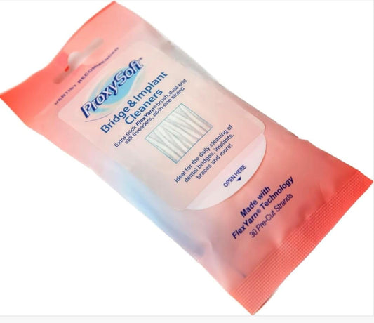 Close-up of ProxySoft spongy Proxy Brush and floss threaders for bridges and implants