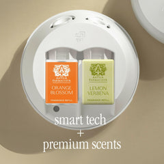 Pura 4 diffuser emitting fragrance in a modern living room
